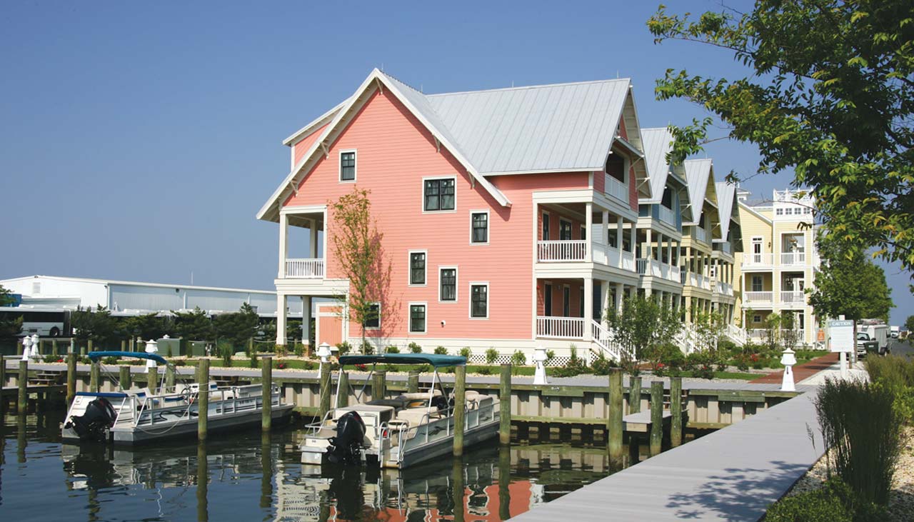 Pink townhome overlooking pier